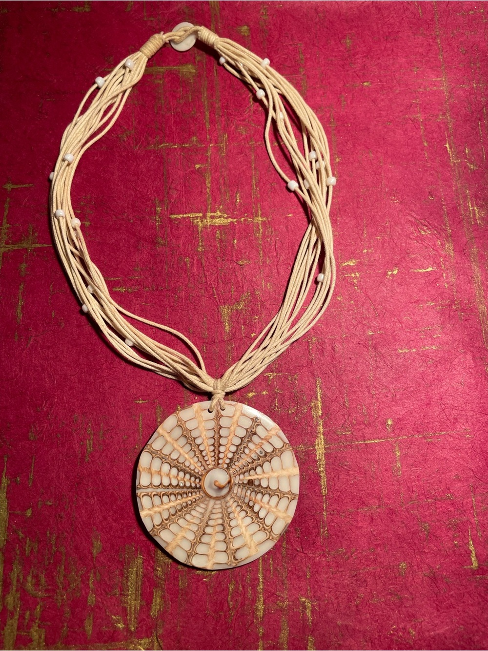 Handcrafted Cream Multi-Strand Necklace with Round Pendant